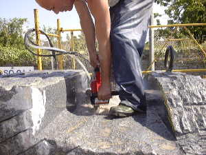 ....diamond chain saw is in action.